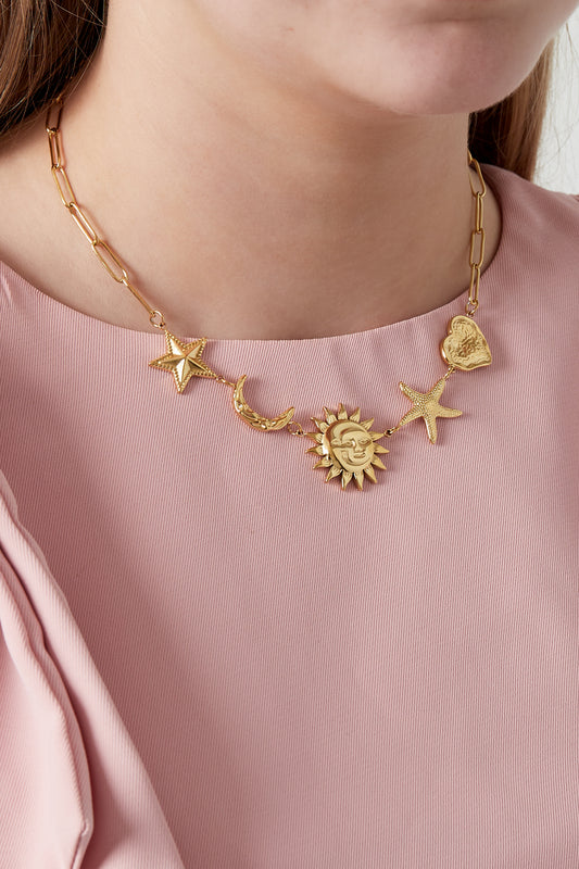 Halsband med sol-, måne- och stjärnberlocker