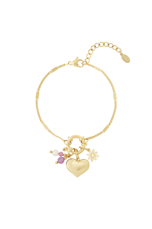 Armband med gyllene hjärtan och utbytbara berlocker
