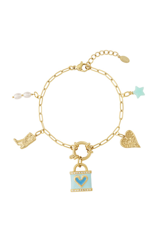 Armband med gyllene lås och utbytbara westernberlocker